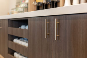 Brown kitchen cabinets with silver hardware in Springfield, Illinois