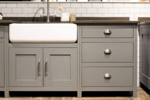 Grey bathroom cabinets with silver cup hardware in Springfield, Illinois