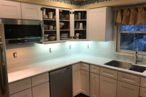 A sold surface countertop for a kitchen in Springfield, IL, with a dual basin under-mount sink.