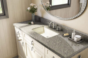 Cultured marble countertop and single basin sink for modern white bathroom vanity in Taylorville, IL.