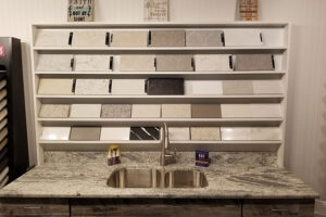 A beautiful shelf display of granite and quartz countertops for a bathroom or kitchen countertop in Springfield, IL.