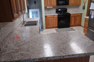 A brand new countertop installed in a residential kitchen in Glenarm, IL thanks to a local business that helped remodel the property.