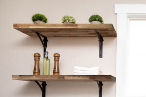 Butcherblock floating shelves with black legs for a residential bathroom in Glenarm, IL that replaced old cabinets.