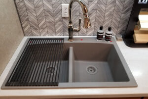 Drop-in sunk with a pull-down kitchen faucet from Kohler® that was installed in a kitchen in Glenarm, IL.