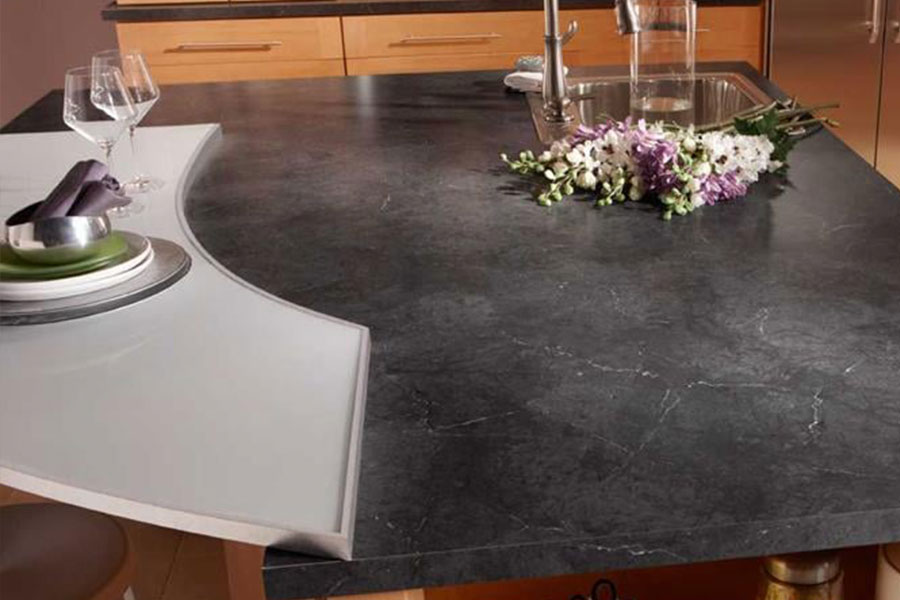 A black marble imitate laminate countertop in a residential kitchen in Glenarm, IL that was installed by countertop professionals at Ray’s Countertop Shop, Inc.