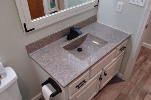 A custom cultured marble bathroom sink countertop for a residential home bathroom in Glenarm, IL.