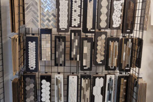 A wall of white, tan, grey, and brown tile options for residential bathrooms in Glenarm, IL for homeowners to choose from.