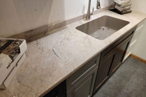 Formica® silver quartzite countertop for a residential kitchen or bathroom and a single basin sink in Glenarm, IL.