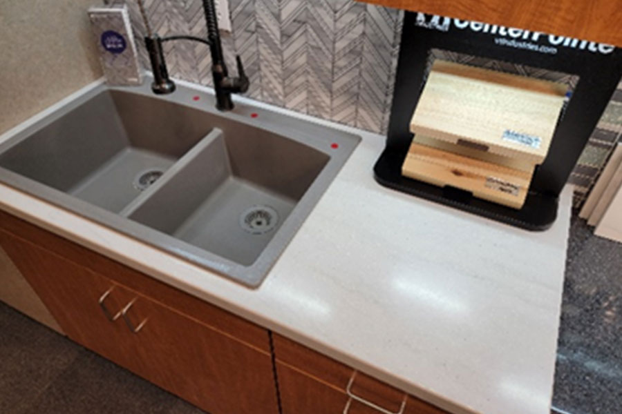 A solid surface countertop with a dual silicone basin sink for a bathroom vanity at Ray's Countertop Shop in Glenarm, IL.