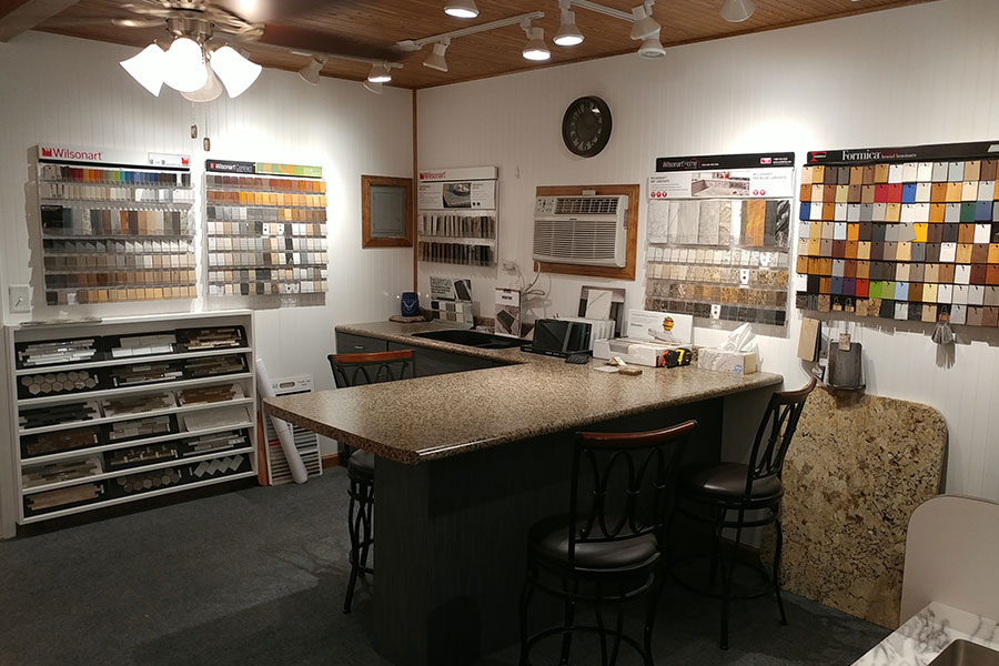 A home improvement showroom with countertop and tile color swatches for homeowners to choose from in Glenarm, IL.