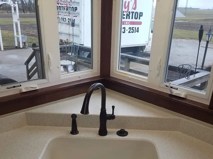 Ray's Countertop Shop Inc. - previous work, solid surface countertop, view from single basin corner sink, Ray's Countertop Shop truck visible outside - Springfield, IL