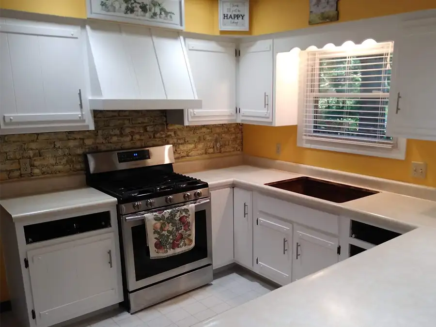 Ray's Countertop Shop Inc. - past projects, yellow kitchen, with rustic faux brick backspash - Springfield, IL