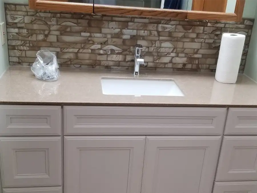 Ray's Countertop Shop Inc. - past projects, neutral tone faux marble tile backsplash, bathroom sink on cultured marble countertop - Springfield, IL