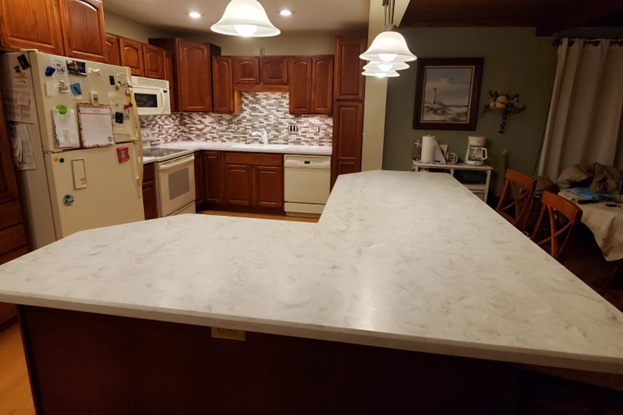 Image of an island with solid surface countertops in the home of a Springfield, IL resident.