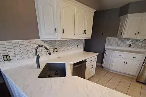 RAY'S COUNTERTOP SHOP INC. - Solid surface countertop with a marble design in the kitchen of a Springfield IL, homeowner.