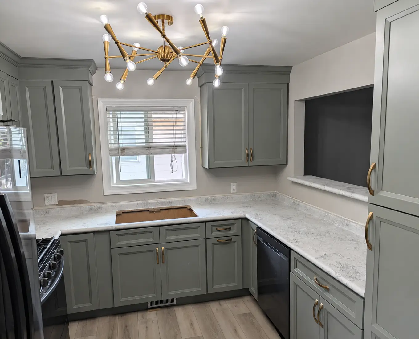 Kitchen with green cabinets and laminate countertop in Springfield IL